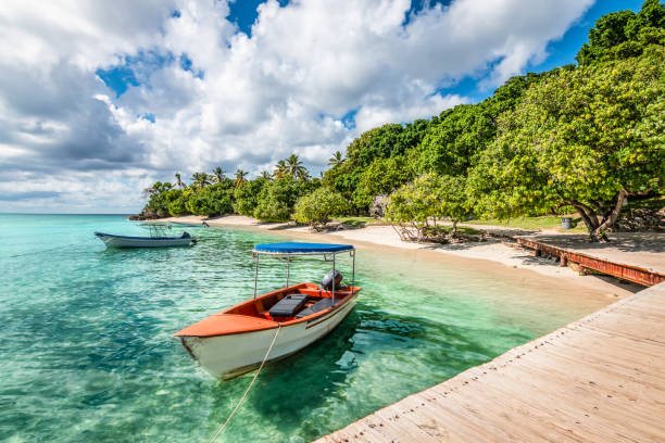 A local boat moored at a wooden jetty