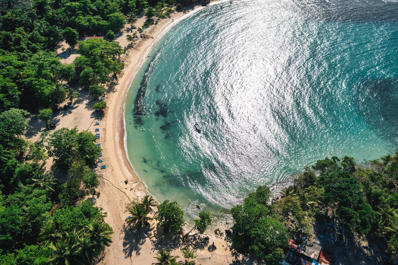 Aerial view of a horseshoe beach on the Samaná peninsula